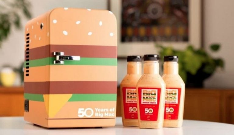 A Big Mac themed mini fridge marked 50 Years of Big Mac beside three limited edition 500ml Big Mac Special Sauce bottles