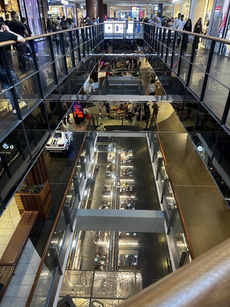 Looking down through several levels of Highpoint's central void towards a sushi train restaurant on the bottom level