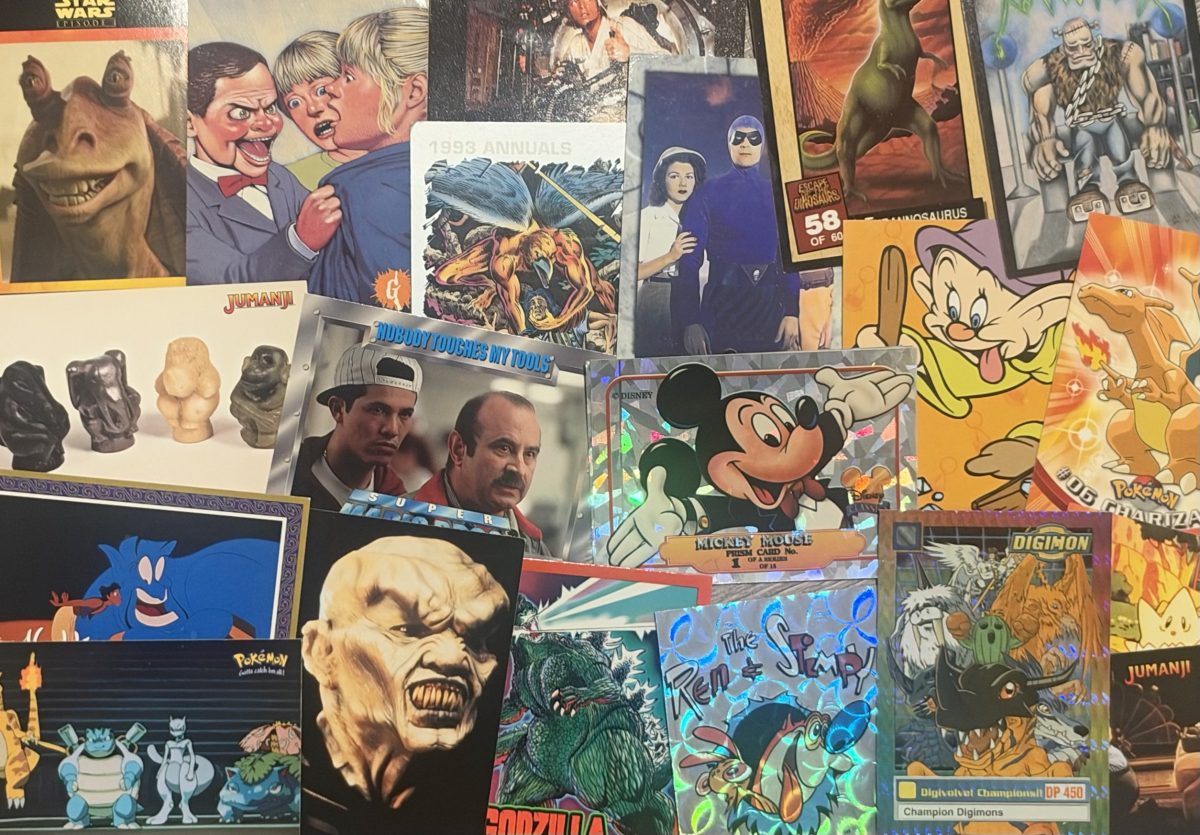 A huge spread of Keith's vintage trading cards, including Star Wars, Disney, Pokémon, Digimon, Jumanji, Godzilla and Ren & Stimpy sets