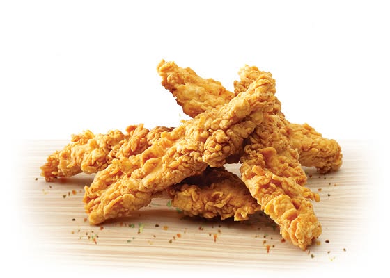 A pile of golden, battered KFC Crispy Strips on a wooden board