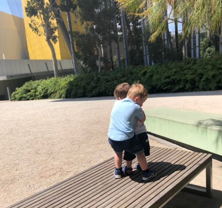 zac charlie hugging at museum